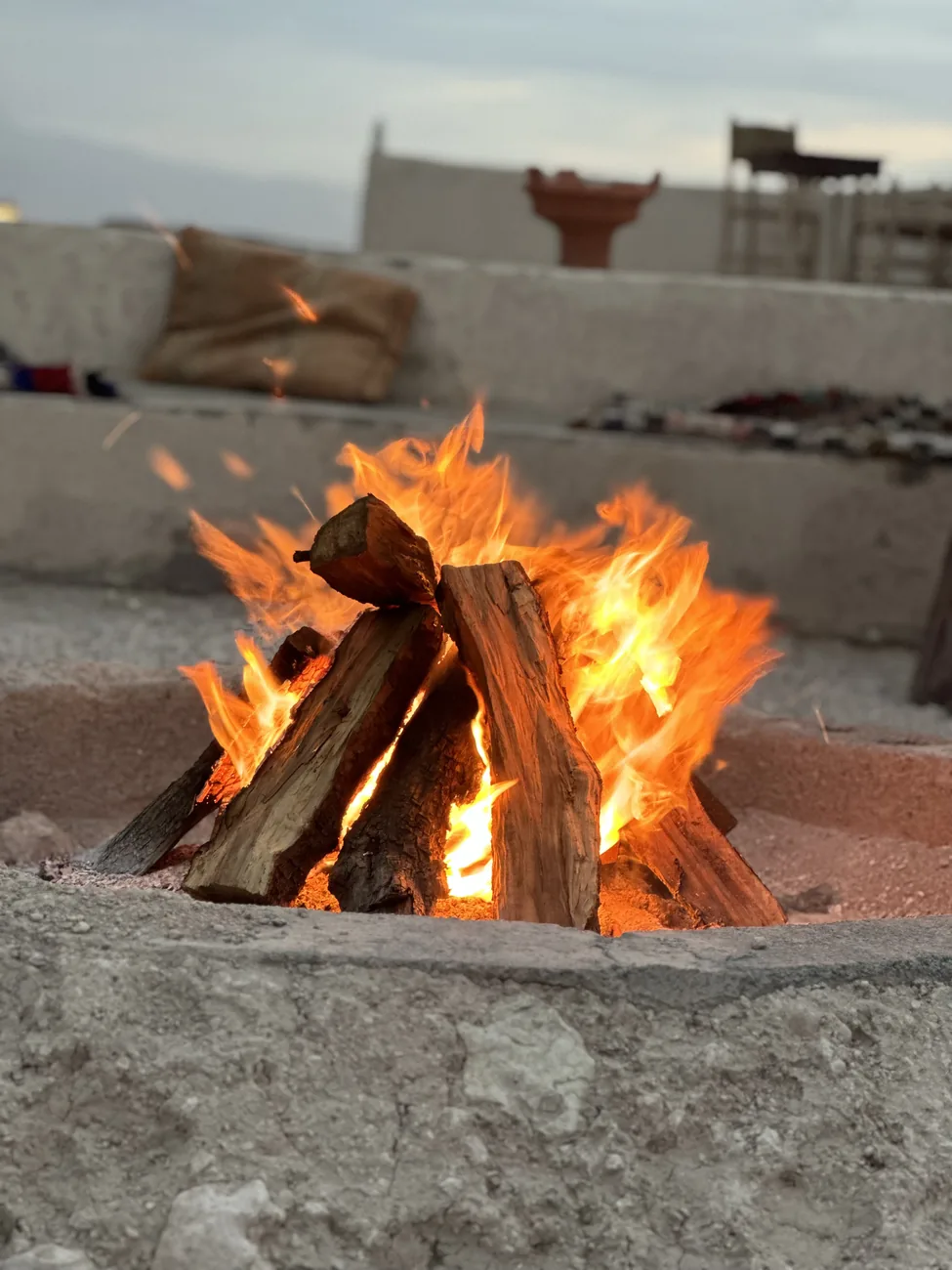 Bonfire at an Agafay desert camp at night